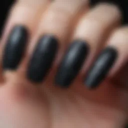 Elegant matte black fake nails with intricate designs